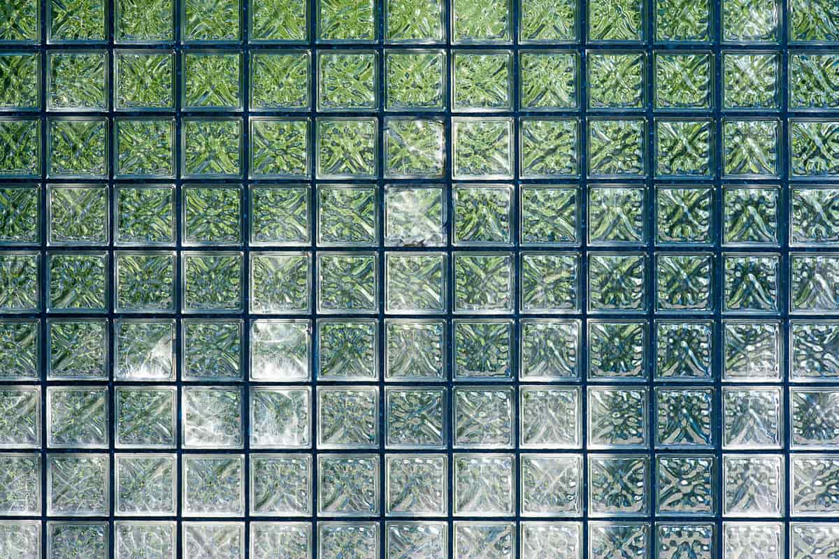 Translucent magnetic tiles being built into a structure on a light floor
