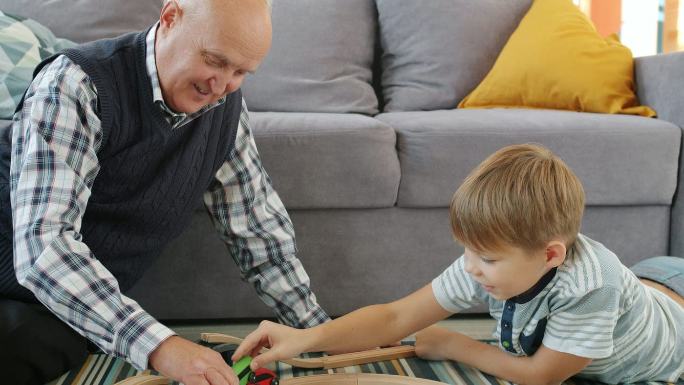 Children of different ages playing with construction toys together